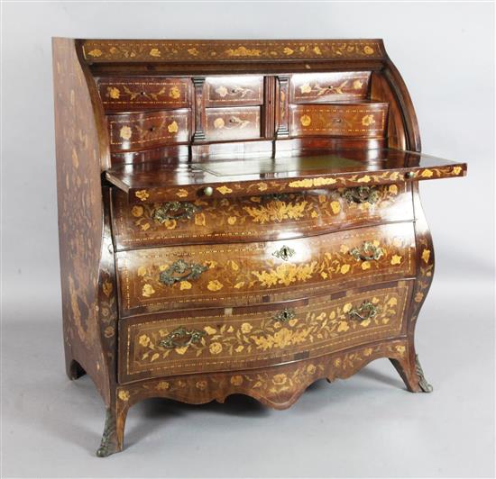 A 19th century Dutch walnut and marquetry bombe cylinder bureau, W.3ft 8in. D.2ft H.3ft 8in.